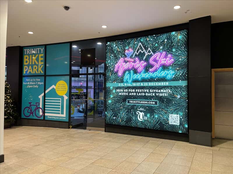 An image of window and wall graphics for the Trinity Bike Park and Apres Ski Weekenders.